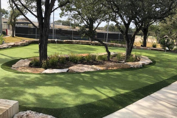 Greenwich residential backyard putting green grass